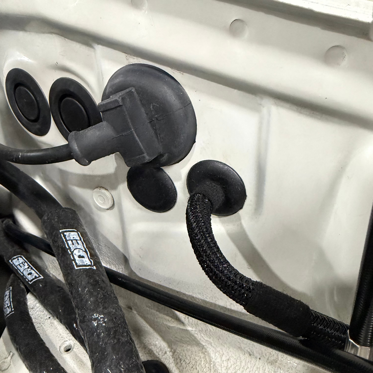 SaikoMFG Miata throttle cable firewall plug close-up